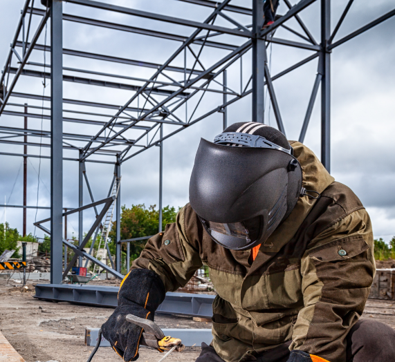 Welder building a steel structure